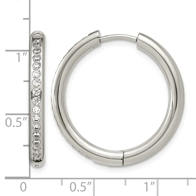 Silver hoop earrings with diamond accents shown next to a ruler measuring approximately one inch in diameter.