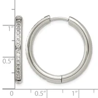 Silver hoop earrings with diamond accents shown next to a ruler measuring approximately one inch in diameter.