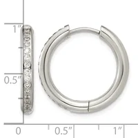 A pair of silver hoop earrings with diamond accents along the outer edge, shown with a measurement scale indicating approximately one inch in diameter.