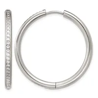 A pair of silver hoop earrings with diamond accents along the inner edges, shown from front and side views.