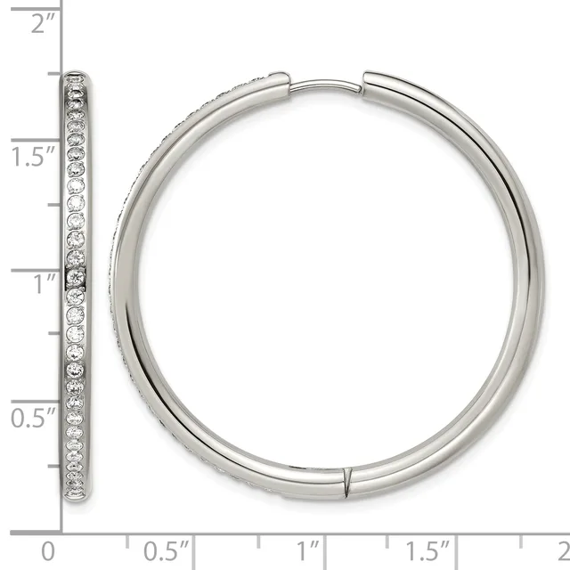 A silver hinge hoop earring with a row of round stones set along the front, displayed next to a ruler showing it measures approximately 1.5 inches in diameter.