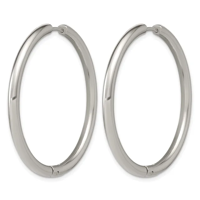 A pair of polished silver-toned oval hoop earrings with hinged closures, shown against a white background.