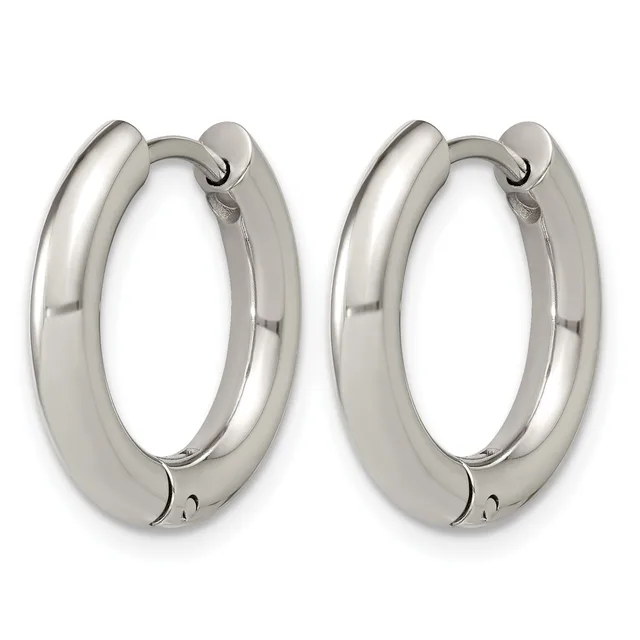 A pair of polished silver-toned chunky hoop earrings with hinged closures, displayed against a white background.