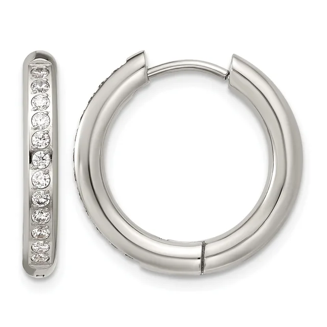A pair of silver hoop earrings with hinged closures, one displaying a row of round diamonds set along its surface.