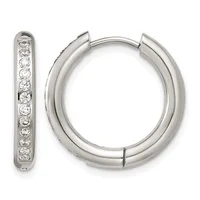 A pair of silver hoop earrings with hinged closures, one displaying a row of round diamonds set along its surface.