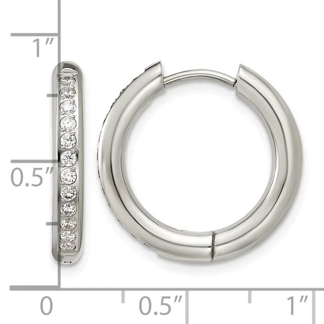 Silver hoop earrings with channel-set round diamonds along the front, displayed with measurement scale showing approximately one inch in length.