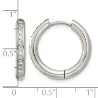 Silver hoop earrings with channel-set round diamonds along the front, displayed with measurement scale showing approximately one inch in length.