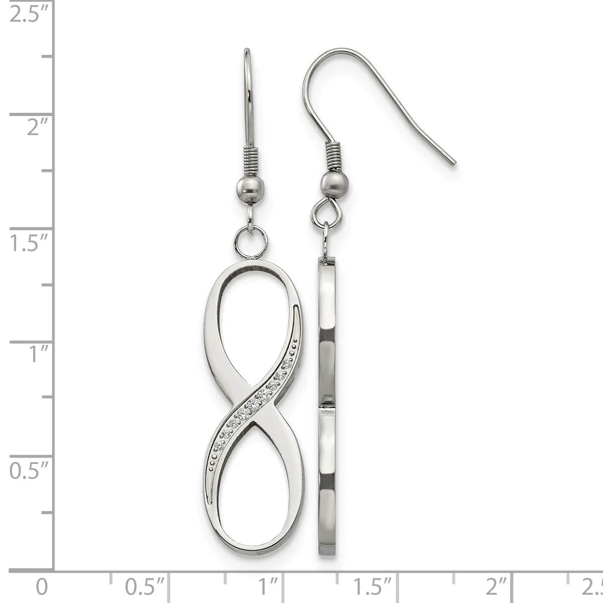 A pair of silver earrings with fish hook wires displayed on a ruler showing measurements up to 2.5 inches, featuring infinity symbol pendants with crystal accents and cylindrical bead details.