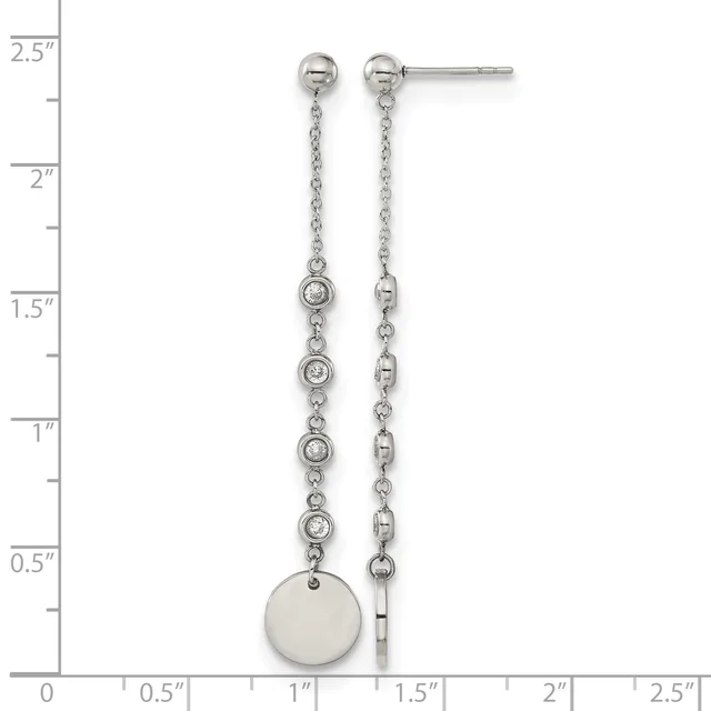 Pair of silver dangle earrings with ball studs, featuring chains set with small round crystals and a larger disc pendant on one side, displayed against a measurement ruler.