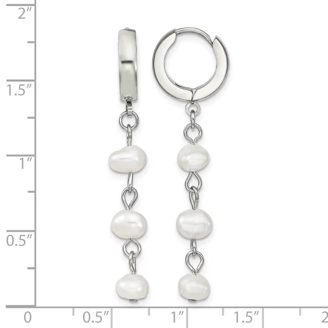 Silver huggie hoop earrings with three white pearl beads dangling from each hoop, displayed against a measurement scale showing approximately two inches in length.