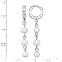 Silver huggie hoop earrings with three white pearl beads dangling from each hoop, displayed against a measurement scale showing approximately two inches in length.
