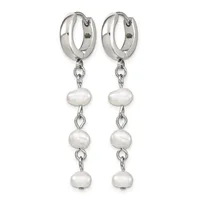 A pair of silver hoop earrings with three white pearl drops suspended from chains on each earring.