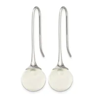 A pair of sterling silver threader earrings with polished spherical white stone pendants suspended from long curved wires.