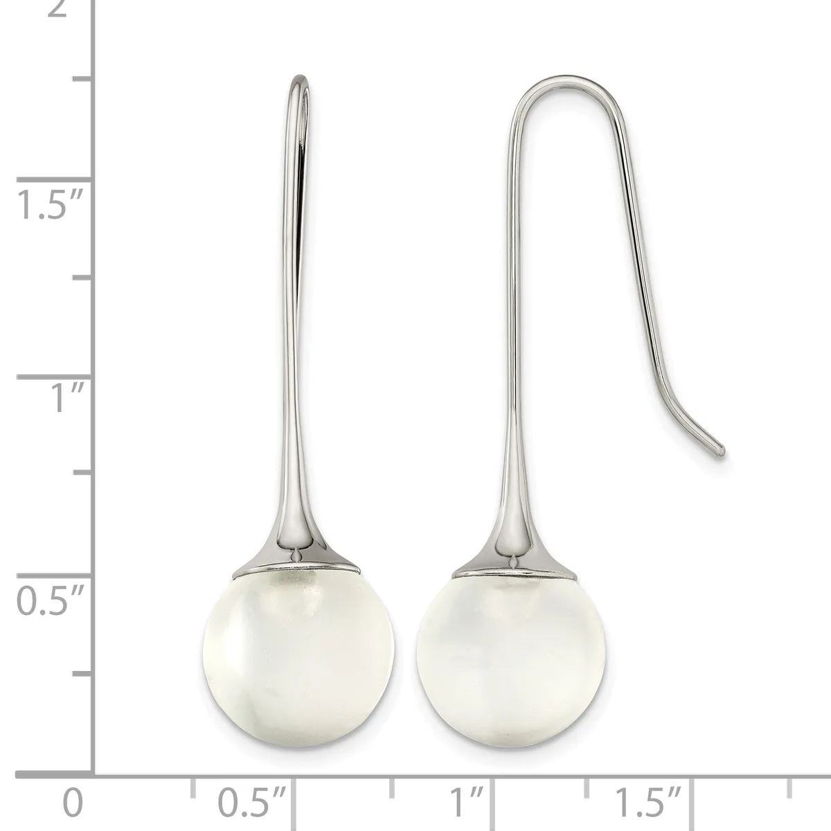 Two silver earrings with white pearl spheres suspended from curved hooks, displayed against a measurement scale showing approximately 2 inches in total length.