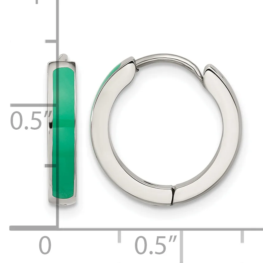 Silver hoop earrings with green enamel inlay shown next to a ruler measuring approximately half an inch in diameter.