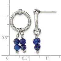 A pair of silver-toned earrings featuring circular wire tops with blue lapis lazuli beads hanging below, displayed against a measurement ruler.