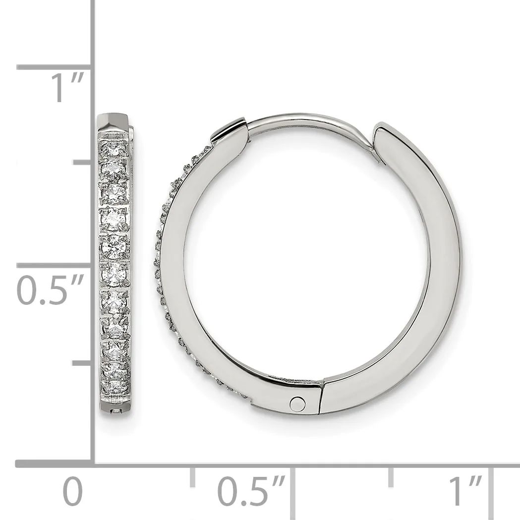 Silver hoop earrings with cubic zirconia stones set along the front, displayed next to a ruler showing approximately one inch in length.