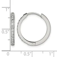 Silver hoop earrings with cubic zirconia stones set along the front, displayed next to a ruler showing approximately one inch in length.