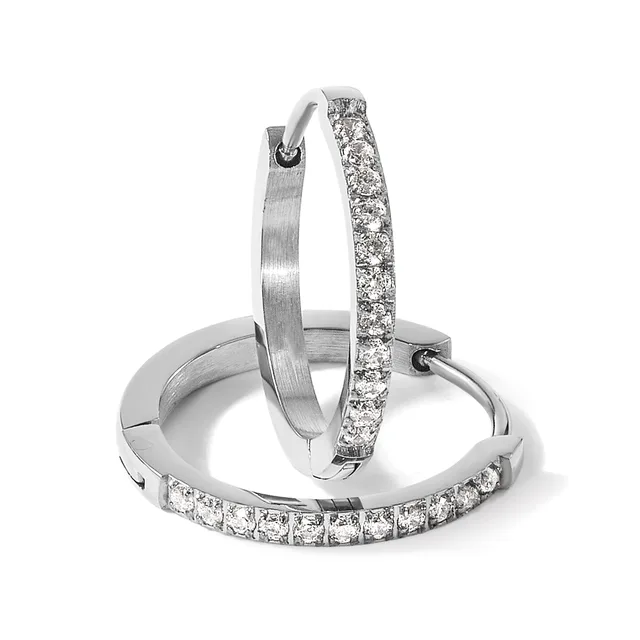 Three silver hoop earrings arranged in a display, two with pavé-set diamonds and one with a brushed finish.