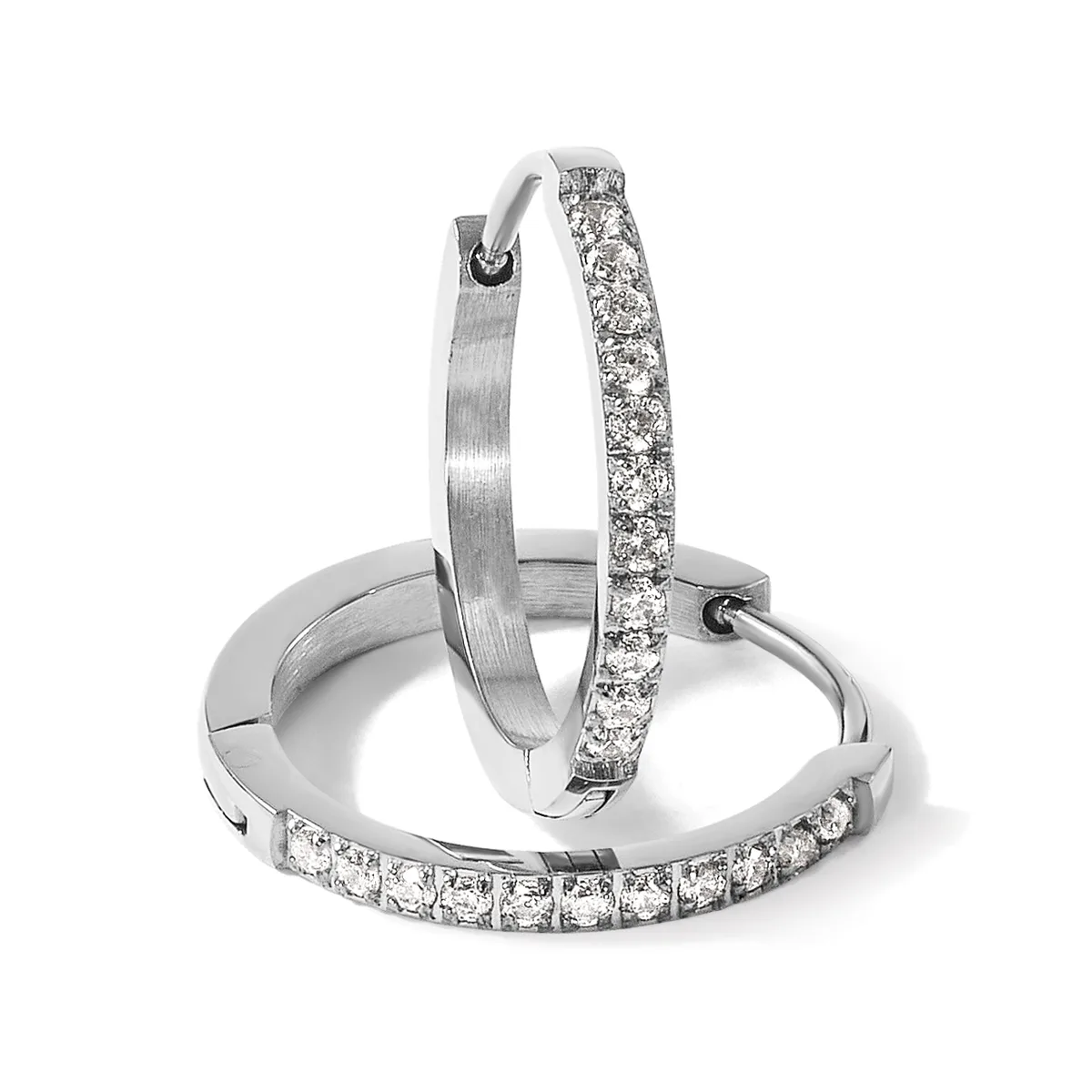 Three silver hoop earrings arranged in a display, two with pavé-set diamonds and one with a brushed finish.