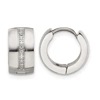 A pair of polished silver huggie hoop earrings with a channel of round diamonds set vertically down the front, shown from front and side views.