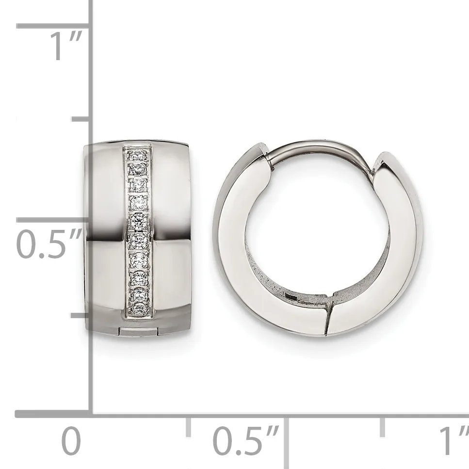 A pair of polished silver huggie earrings with a vertical channel of round diamonds, shown from front and side views against a measurement ruler.