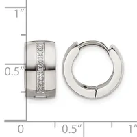 A pair of polished silver huggie earrings with a vertical channel of round diamonds, shown from front and side views against a measurement ruler.