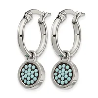 Pair of silver hoop earrings with turquoise stone disc charms hanging from the bottom.
