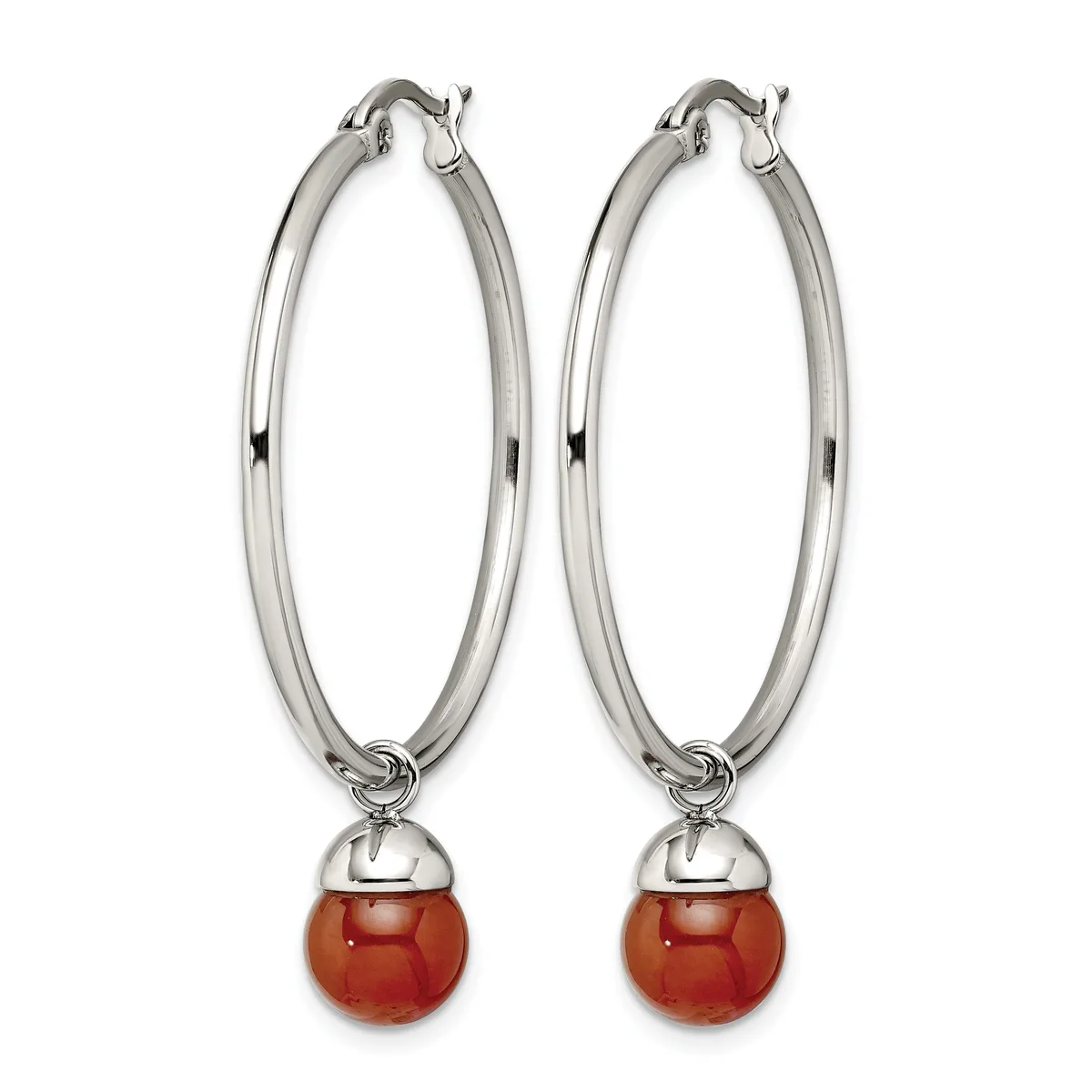 Pair of silver-toned hoop earrings with polished oval loops and red spherical stone drops suspended from small caps.