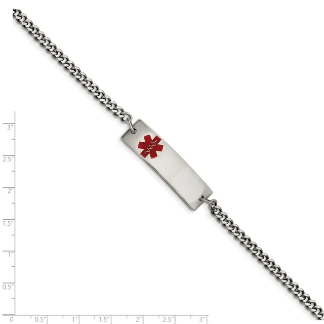 A stainless steel curb chain bracelet with a rectangular medical alert tag featuring a red star of life symbol, displayed against a measurement scale.