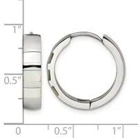 A pair of hinged silver hoop earrings with mother-of-pearl inlay shown next to a ruler measuring approximately one inch in diameter.