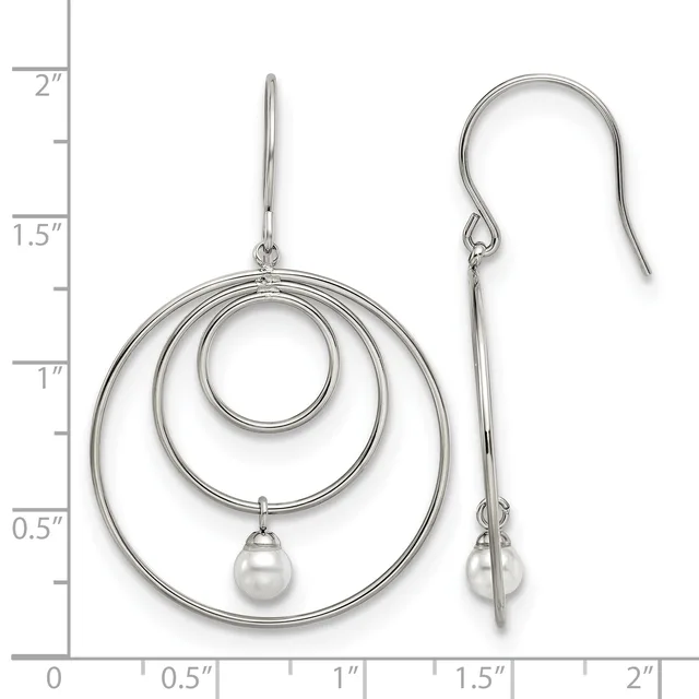 Silver concentric circle dangle earrings with pearl drops, shown on a measurement scale indicating approximately 2 inches in length.