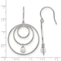 Silver concentric circle dangle earrings with pearl drops, shown on a measurement scale indicating approximately 2 inches in length.