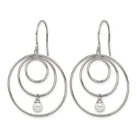 A pair of silver-toned drop earrings featuring three concentric circles with a small white pearl suspended from the innermost circle, hanging from curved ear wires.