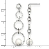 A pair of silver-toned dangle earrings with progressively larger rings linked together, each suspending a white pearl at the bottom, shown against a measurement scale.