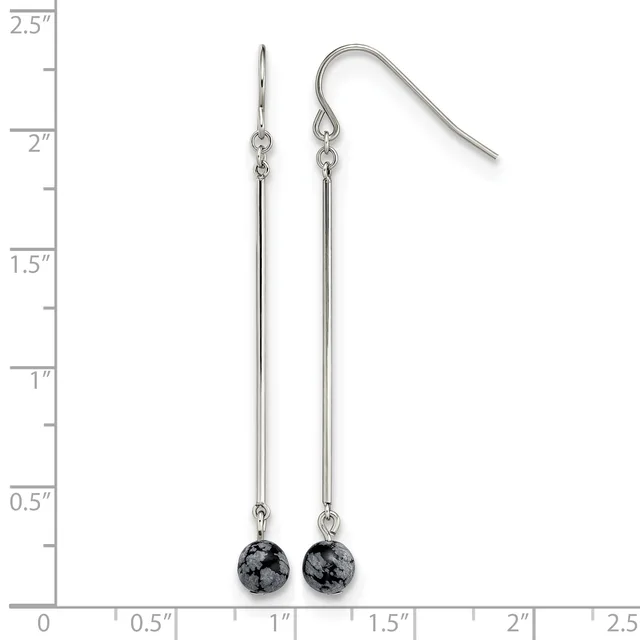 Pair of silver-toned dangle earrings with long thin bars topped by small black speckled round stone beads, displayed against a ruler showing approximately 2.5 inches in length.