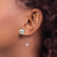 A person wearing a dangling earring with a polished spherical stud and a delicate chain suspending a small crystalline drop below it.