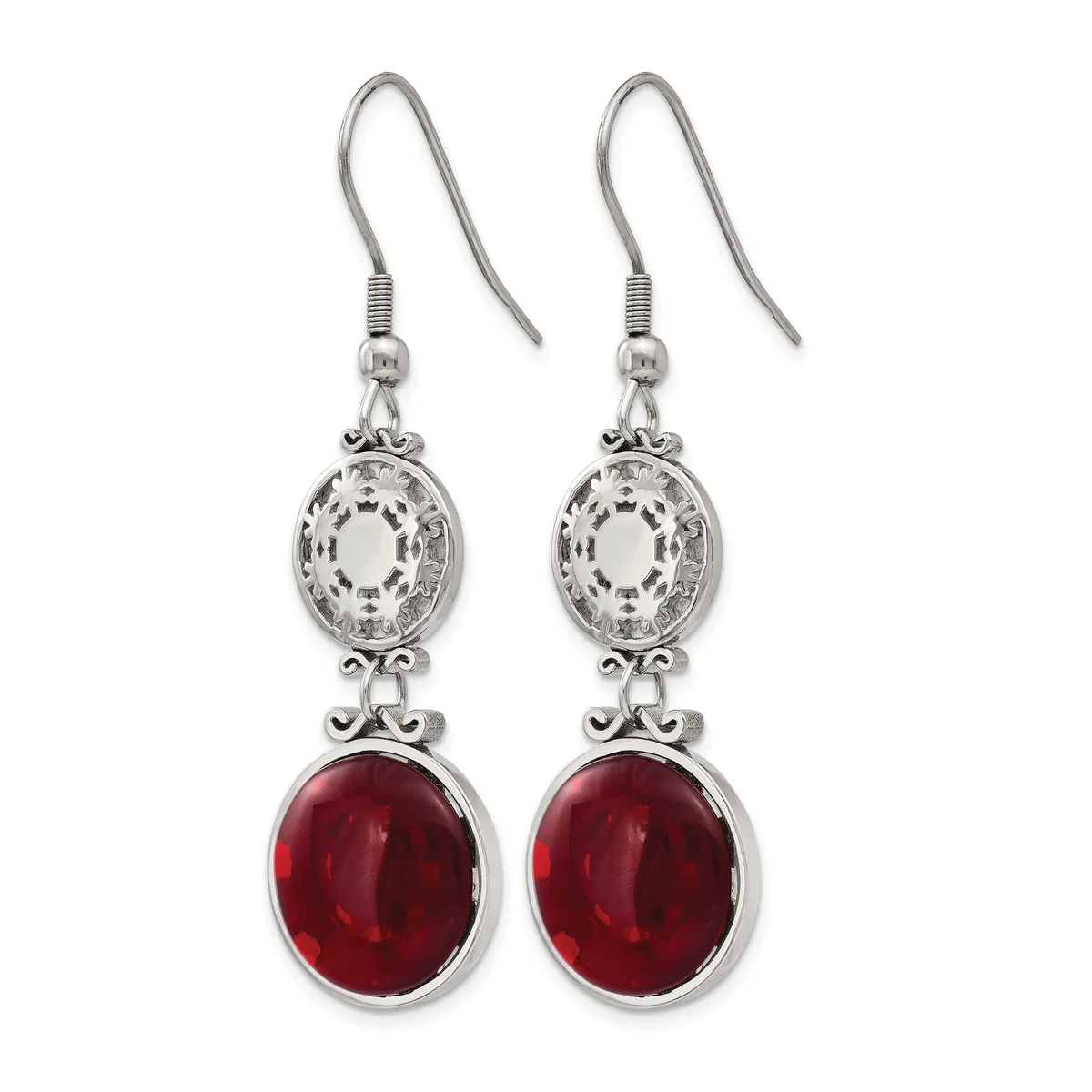 Pair of silver-toned drop earrings with ornate oval filigree tops and deep red oval gemstone bottoms, suspended from shepherd's hook wires.