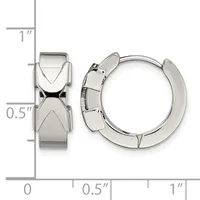 A pair of polished silver-toned chunky hoop earrings with geometric X-shaped designs on the front, shown next to a measurement ruler.