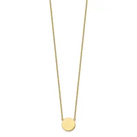 A delicate gold chain necklace with a small polished circular gold disc pendant hanging at the center.