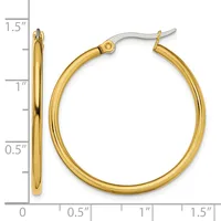 A pair of polished gold-colored hoop earrings with posts and backs, displayed against a measurement scale showing approximately 1.5 inches in length.