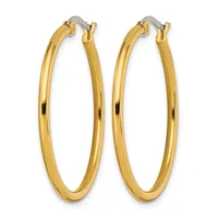 A pair of polished gold-toned hoop earrings with oval shapes and hinged closures, displayed against a white background.