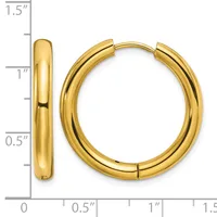 A pair of polished gold-colored hoop earrings with a hinged closure, displayed next to a ruler showing they measure approximately 1 inch in diameter.