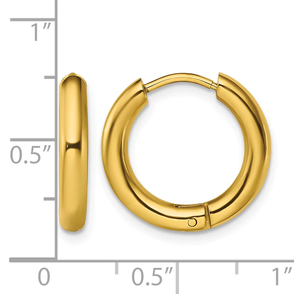 A pair of polished gold-toned chunky hoop earrings with hinged closures, shown next to a ruler indicating approximately one inch in height and half inch in width.