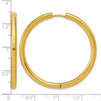 A polished gold-tone hinged bangle bracelet shown from front and side views with a measurement scale indicating approximately 1.5 inches in diameter.