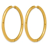 A pair of polished gold-toned oval hoop earrings with hinged closures, displayed side by side against a white background.