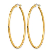 A pair of polished gold-tone hoop earrings with a smooth, rounded oval shape and hinged closure posts, displayed against a white background.