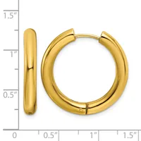 A pair of polished gold hoop earrings displayed against a measurement scale showing they are approximately one inch in diameter.