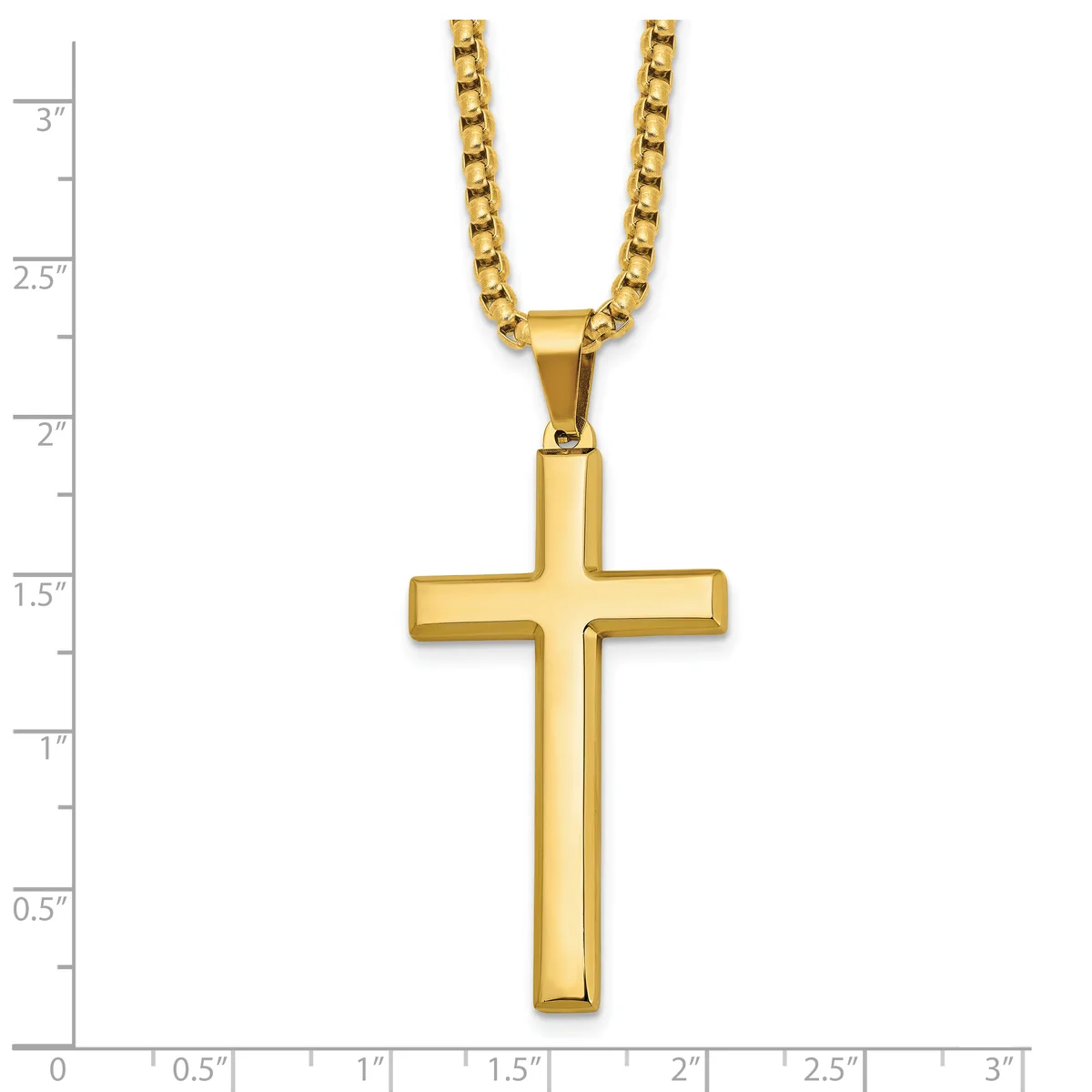 Gold-toned cross pendant on a gold box chain necklace, displayed against a ruler showing the cross is approximately 1.5 inches tall.