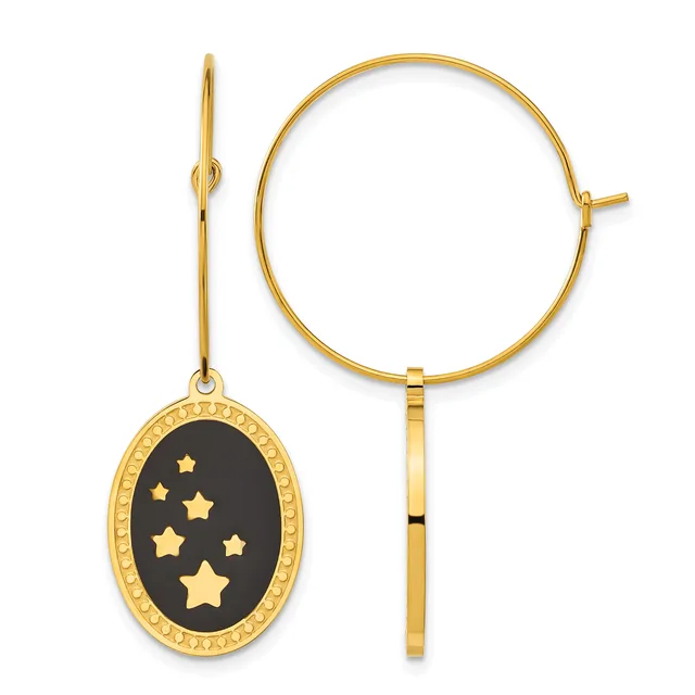 Gold-toned bangle bracelet and matching dangle earring with black oval pendant featuring gold stars and decorative border.